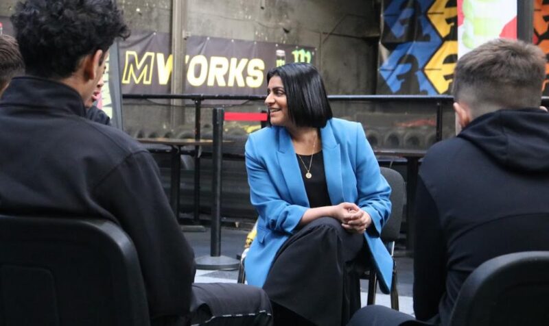 Shabana speaking to young people trackside at Teamworks Karting.